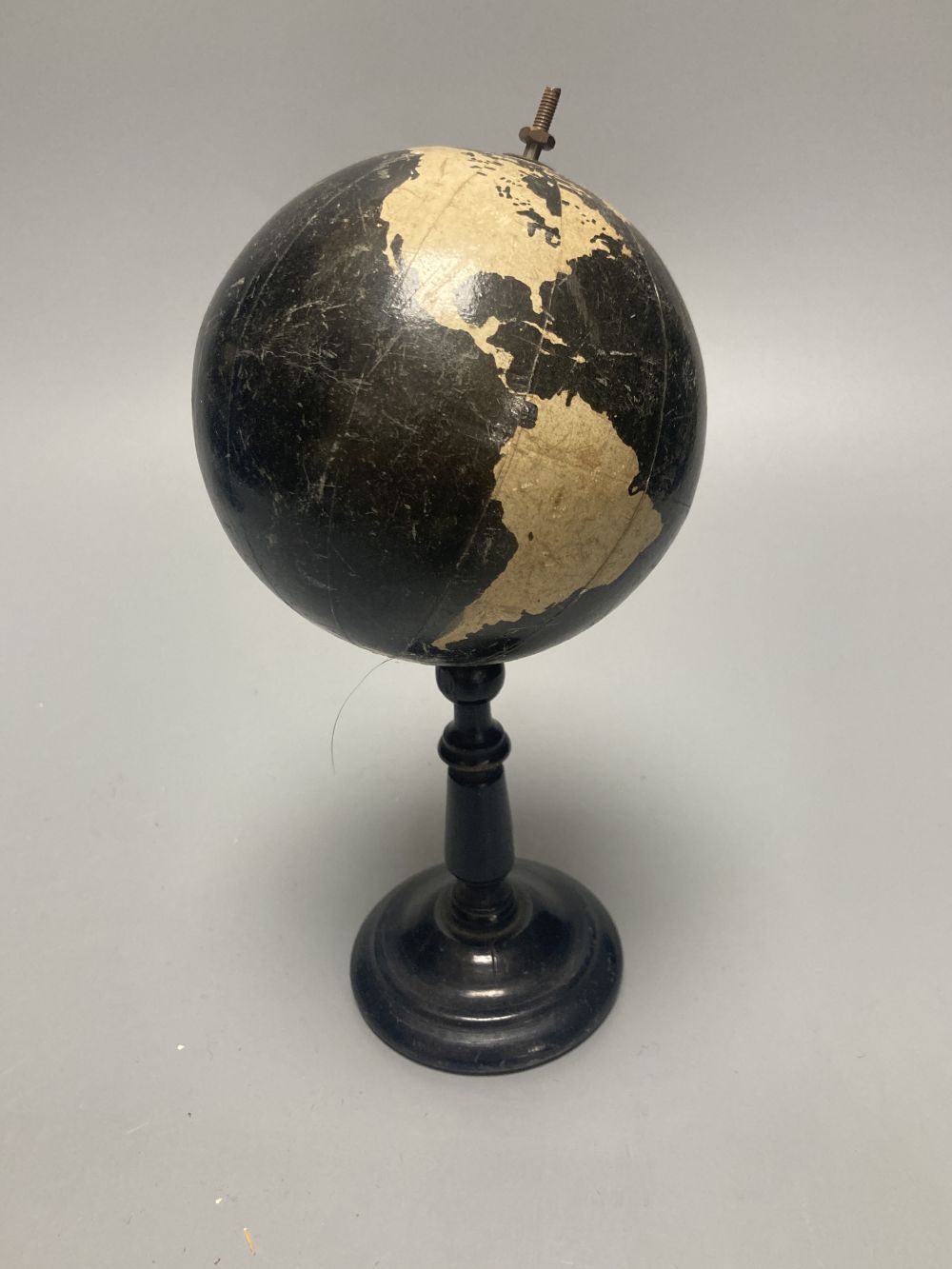 A Reliable Series lithographed tinplate revolving globe, 20cm, and two graphic globes,on ebonised wood bases, one by Philips